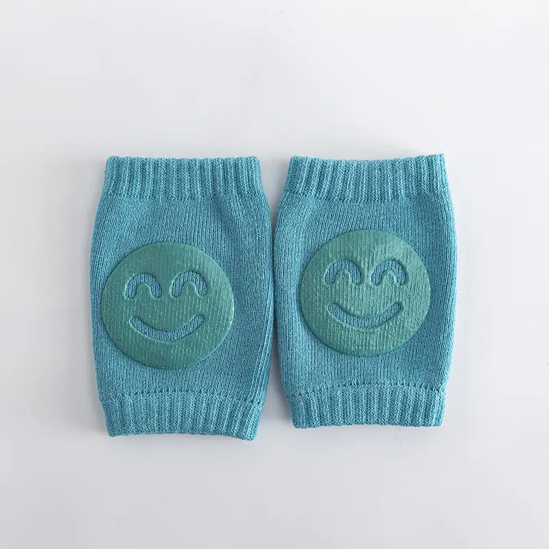 Anti-slip baby crawling knee pads pair in teal with smiley grip
